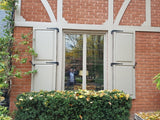 Custom PVC shutters with raised panels.jpeg