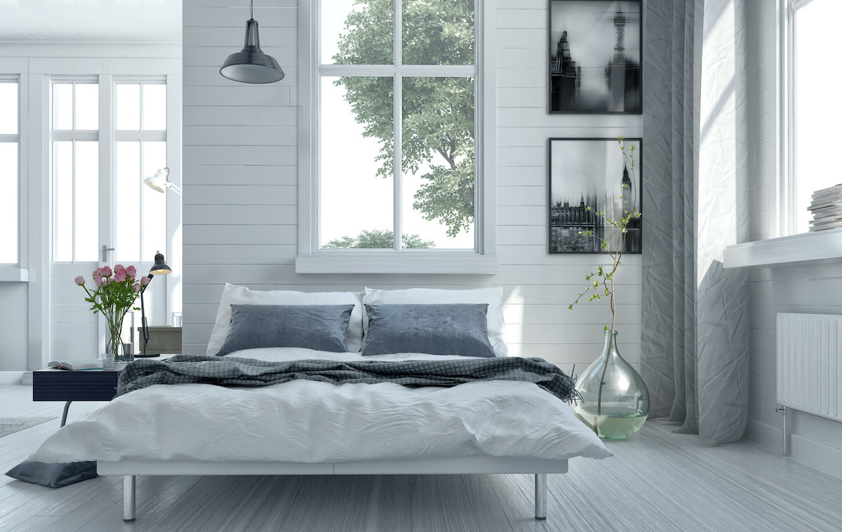 Shiplap planks create a modern farmhouse look in this bedroom
