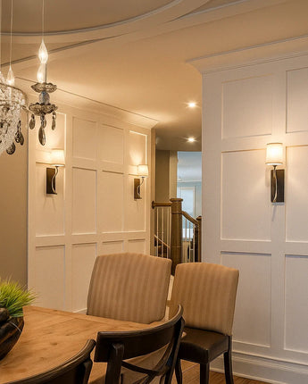 Shaker style MDF stiles used to create full-height wall paneling in a dining room with clean rectangular grids and smooth primed finishes.