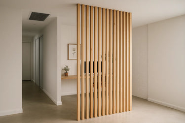 Wooden slat room divider in a modern interior setting. The vertical hardwood pieces create a stylish visual barrier between rooms.