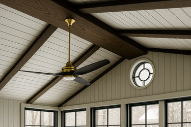 Custom-sized stained red oak ceiling beam in a room featuring a ceiling fan and a large oval window, adding warmth and architectural contrast to the space.