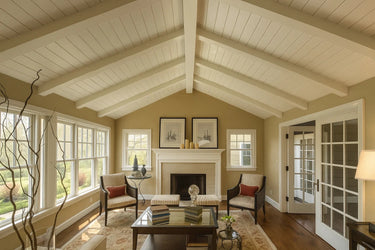 Vaulted living room ceiling with white MDF wood beams and tongue and groove panels, showcasing seamless mitred panels for a classic, elegant design.